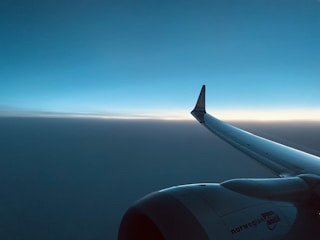 An airplane taking off at sunrise symbolizing speed and reliability.