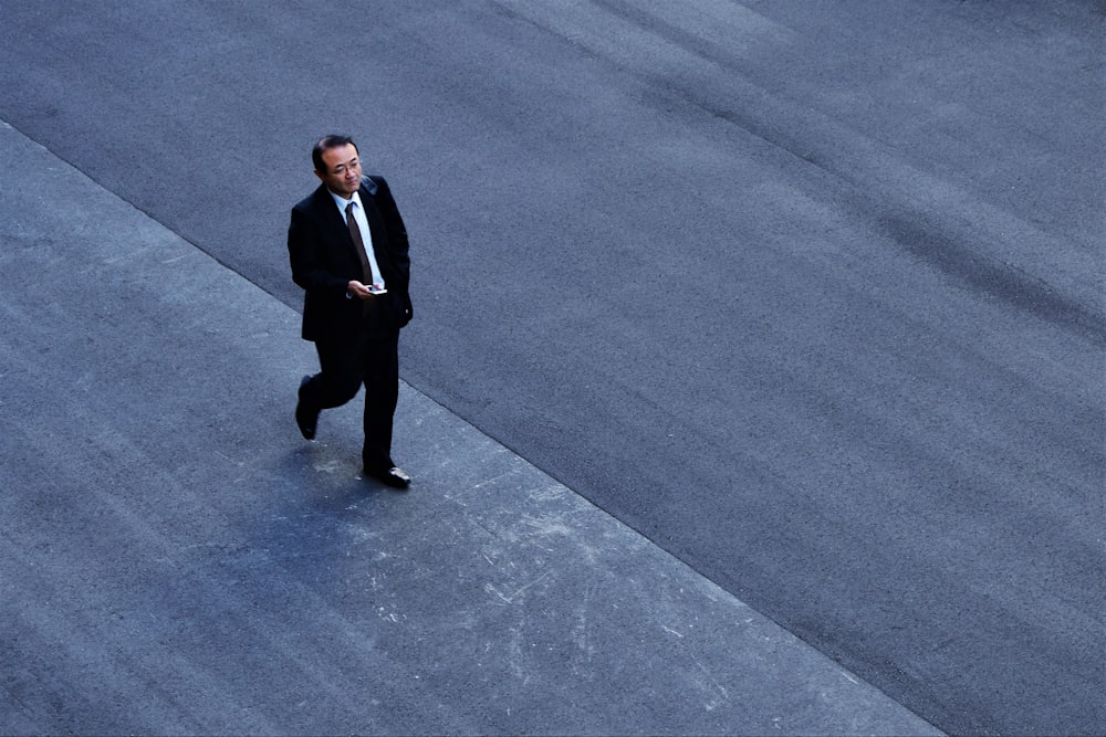 man walking on the road