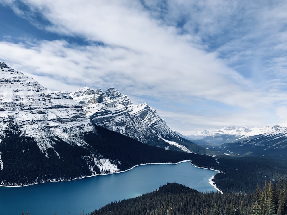 mountain covered by snow along river