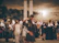 A candid shot of a couple dancing under soft event lighting.