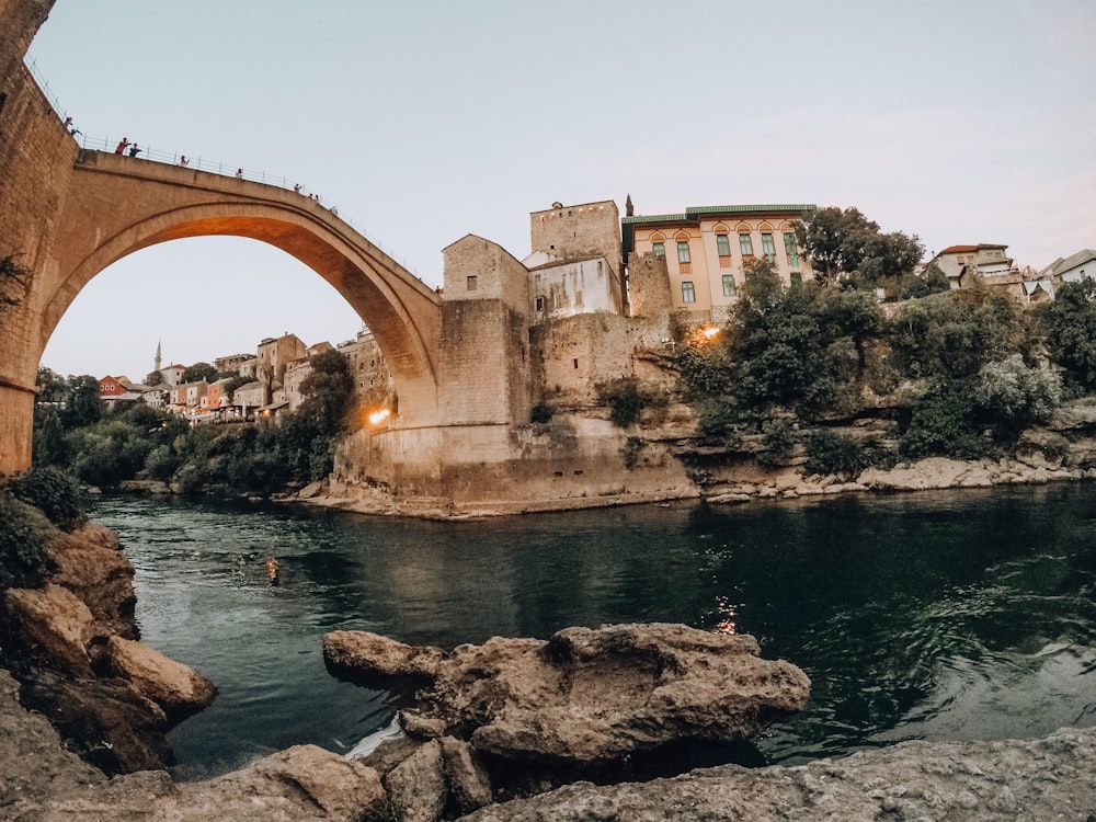 brown concrete arch bridge