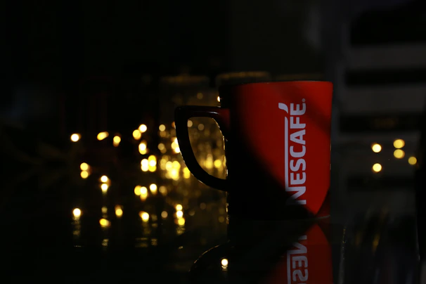 Close-up of a vibrant custom-printed mug with a family logo.