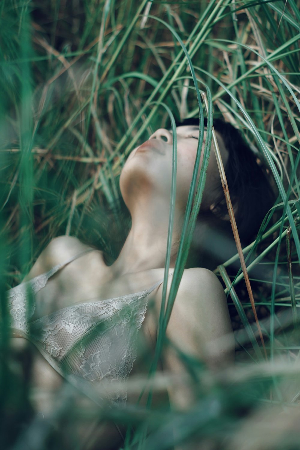 woman laying down on grass