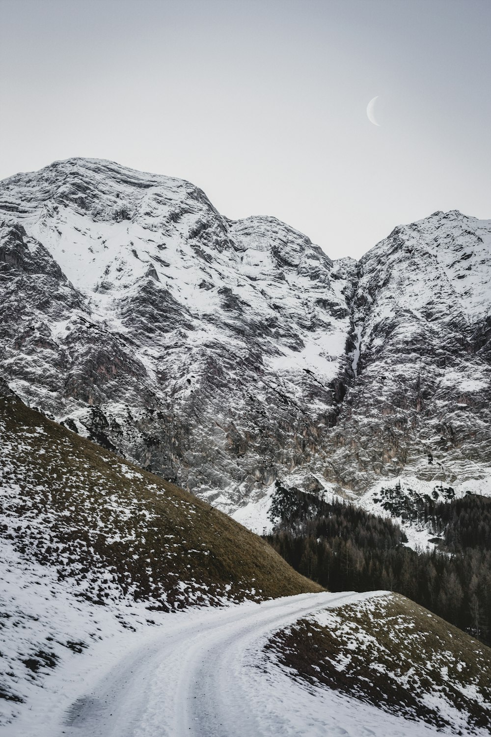 road near snow capped rocky mountain