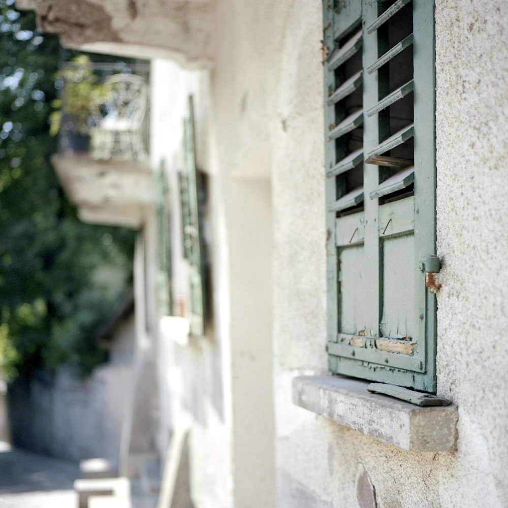 closed teal wooden window