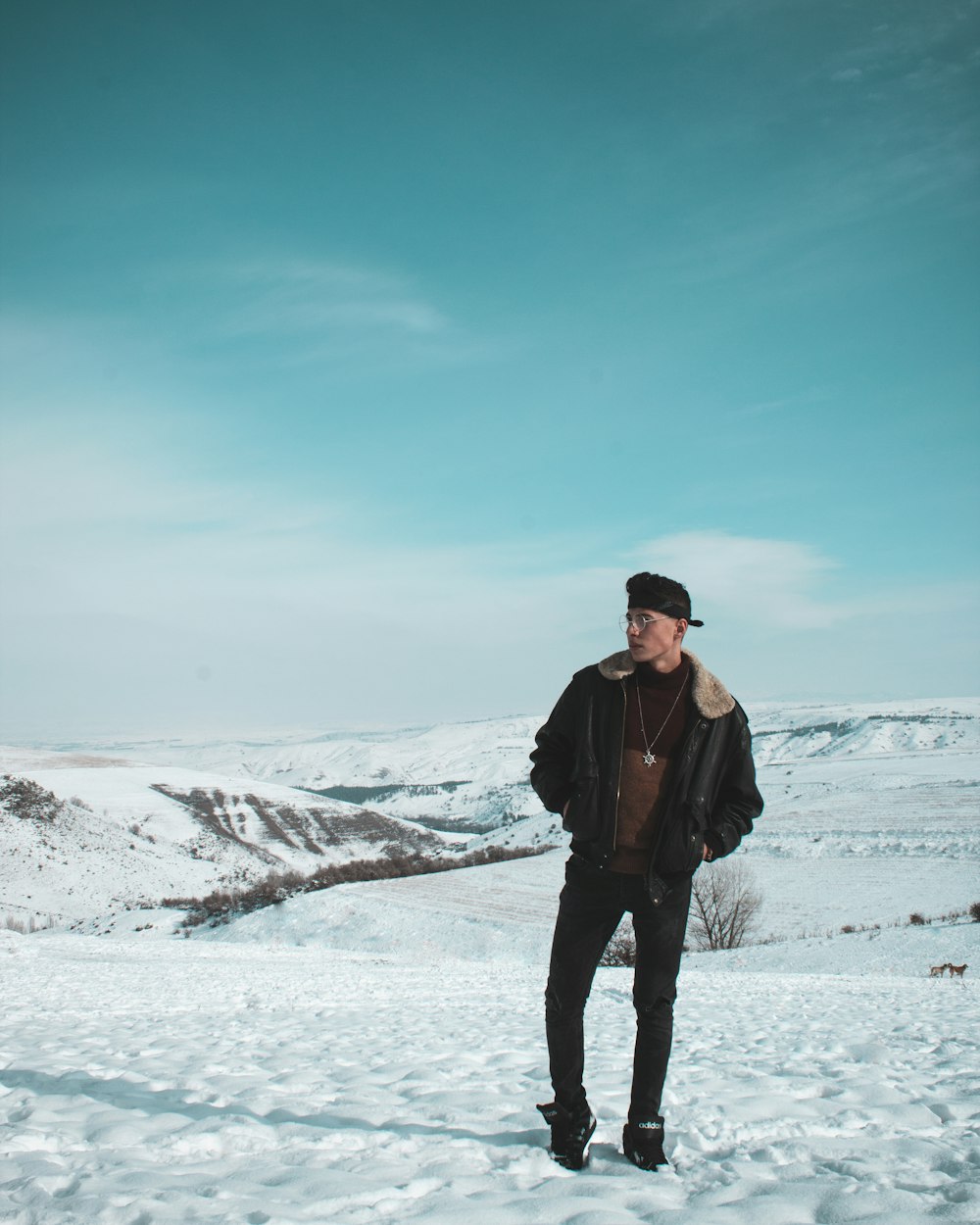 man standing on snow ground