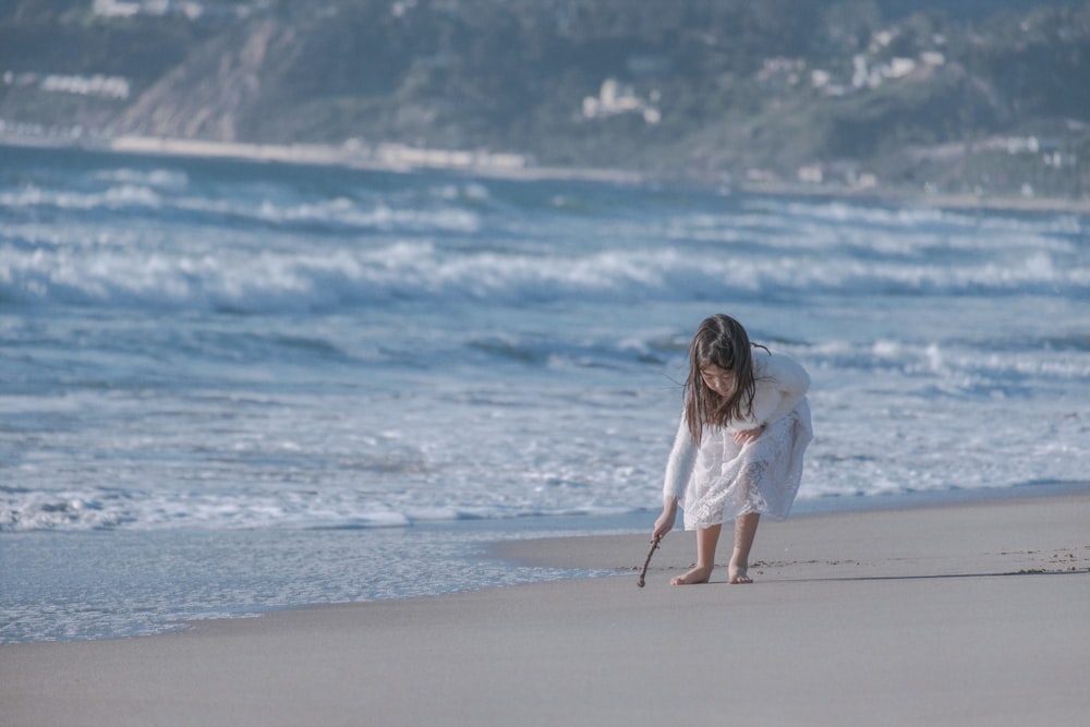 girl on seashore during daytime