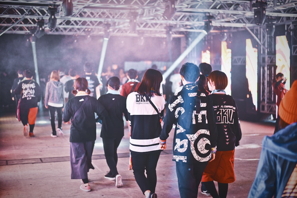 group of people walking inside the building