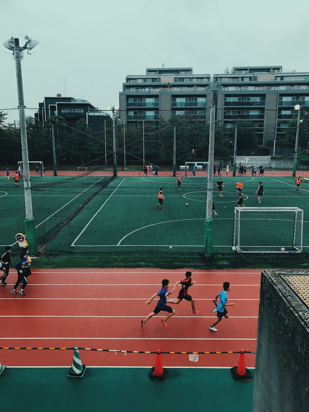 people on field doing sports at daytime