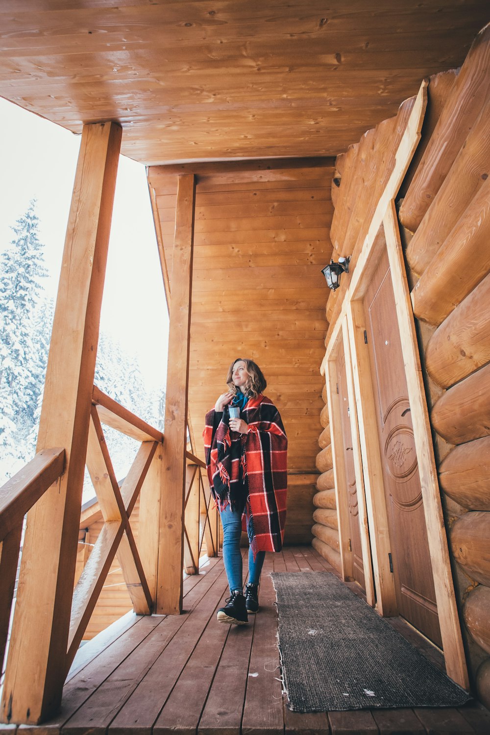 woman walking at the porch during day