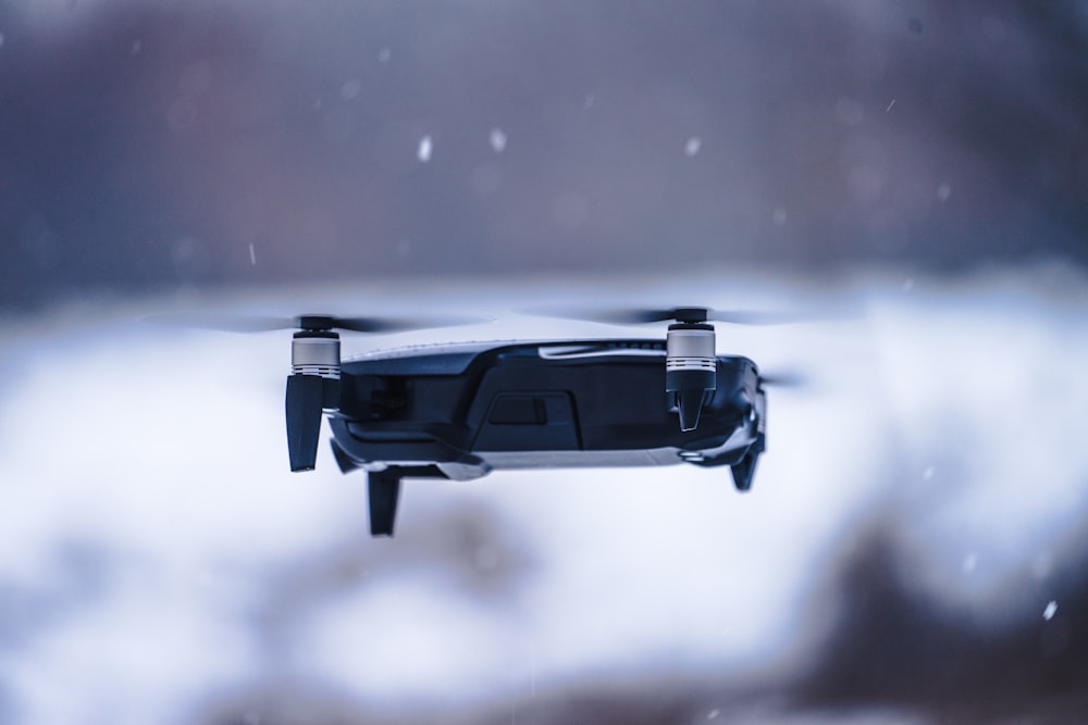 gray and black quadcopter drone