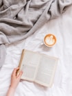 creamy coffee in white ceramic teacup