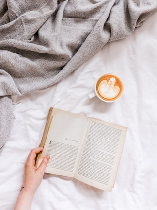 creamy coffee in white ceramic teacup