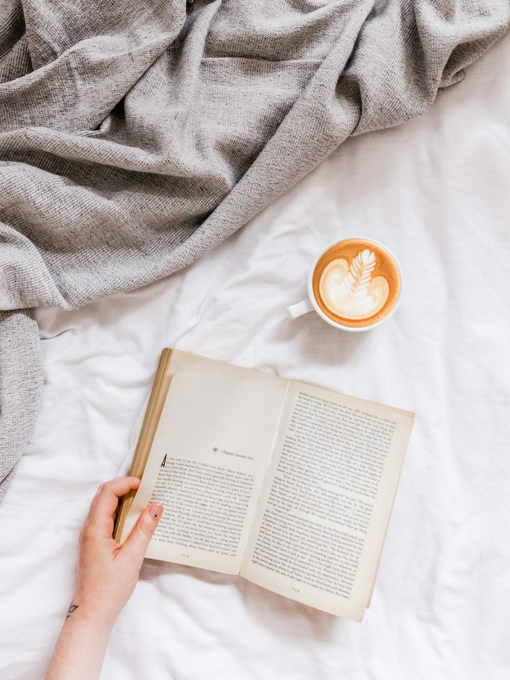 creamy coffee in white ceramic teacup