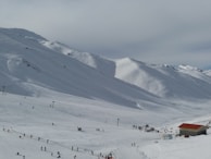 A group of skiers taking a lesson on the slopes.