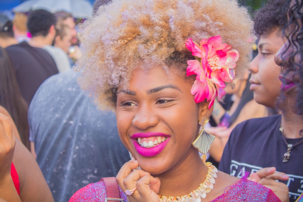 woman smiling near people