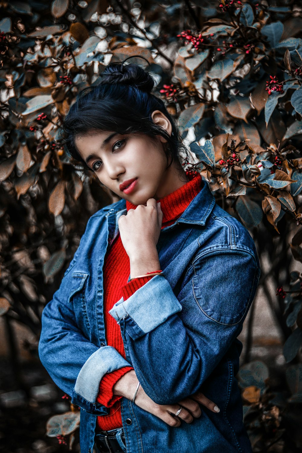 selective focus photography of woman wearing blue denim jacket