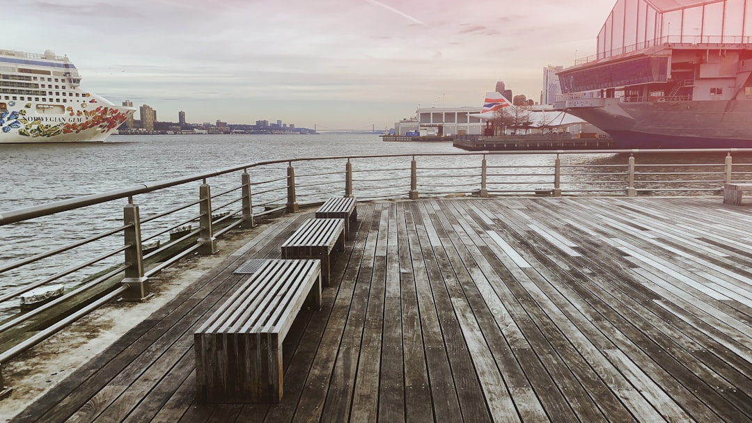 brown dock near ship under white sky during daytime