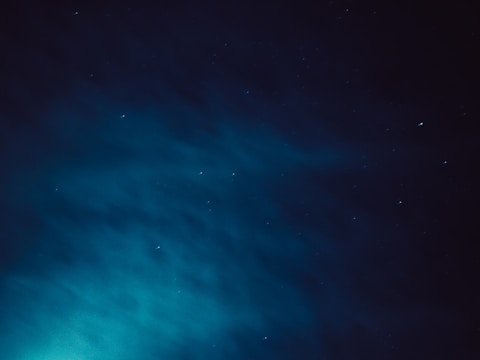 Starry night sky with a subtle neon grid overlay, evoking futuristic space tech.