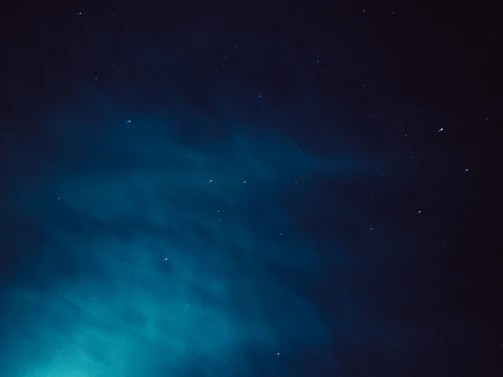 A serene collage featuring vintage textures and shimmering silver accents under a night sky.