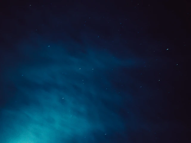 A deep blue night sky with earth orbits glowing softly in the background, symbolizing strength and heritage.