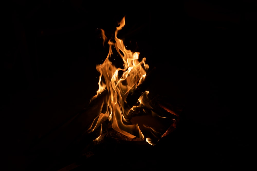 a close up of a fire in the dark