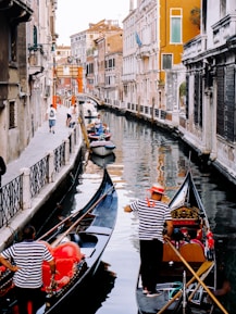 3 gondolas in canal