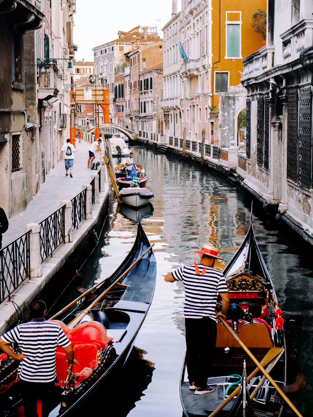 3 gondolas in canal