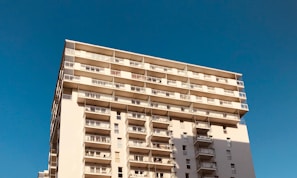 Charming façade of a residential building under clear blue sky.