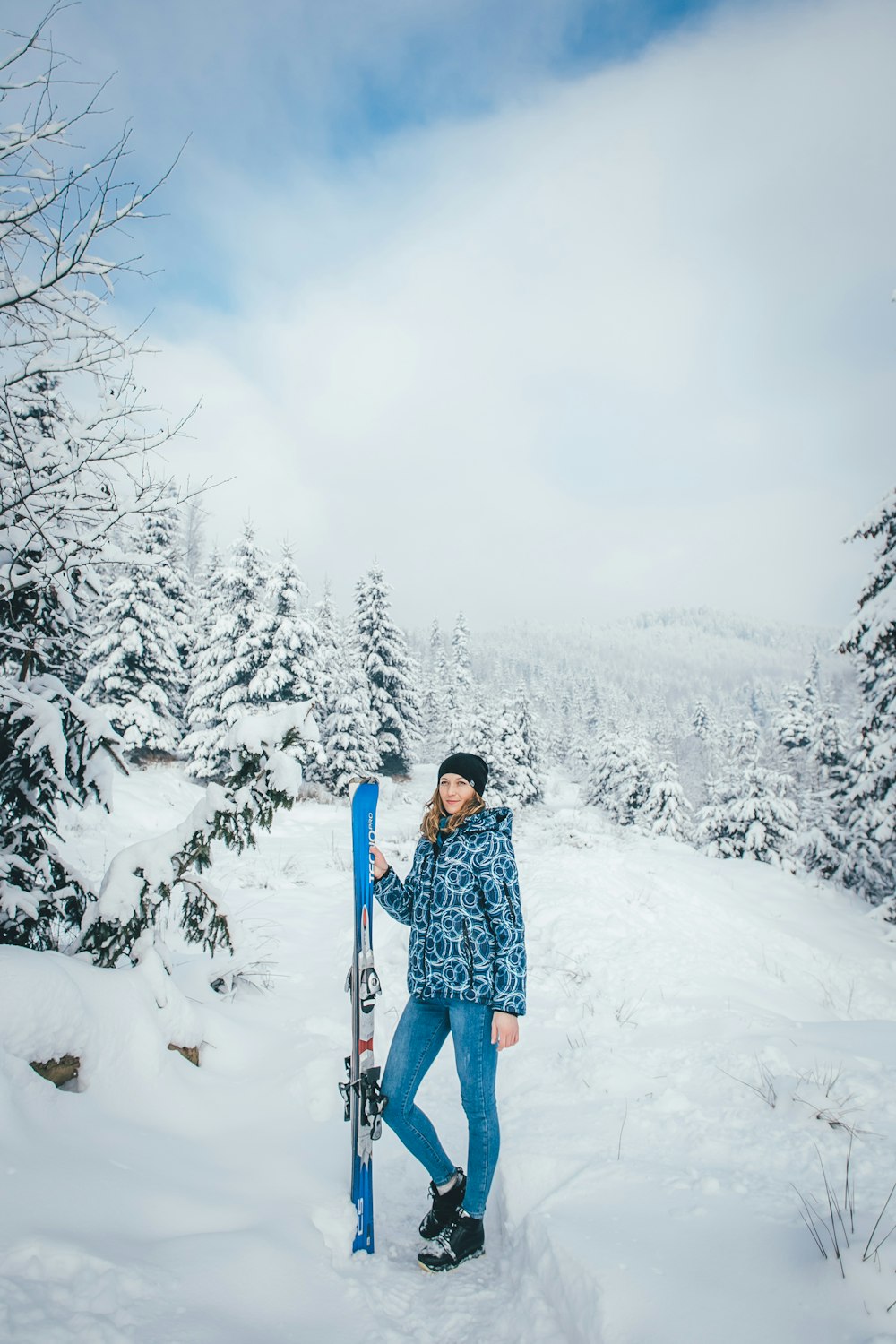 woman holding blue ski board