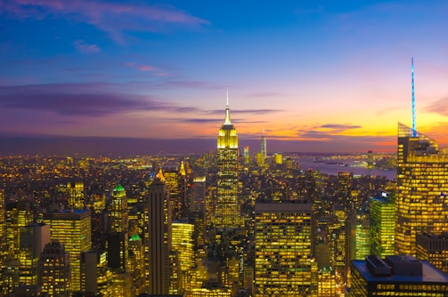 A vibrant cityscape with colorful buildings at sunset.