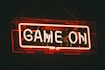 red and white Game On LED signage
