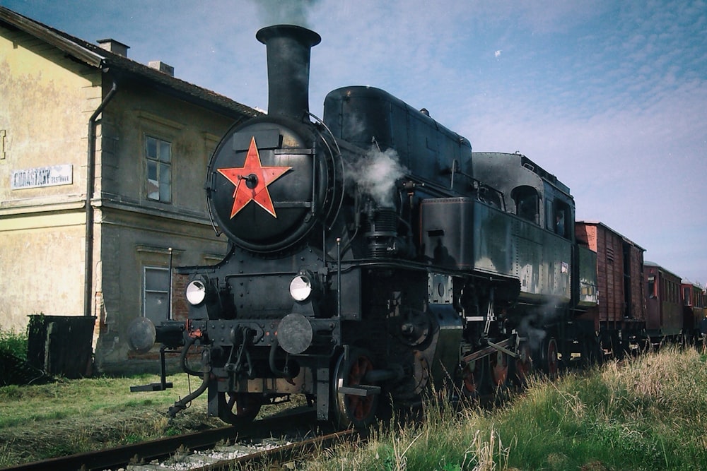 black train near building during daytime