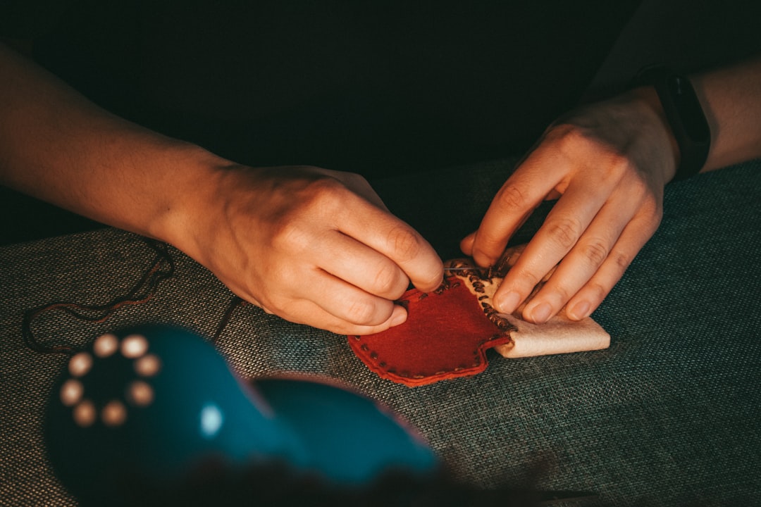 person holding leather pouch