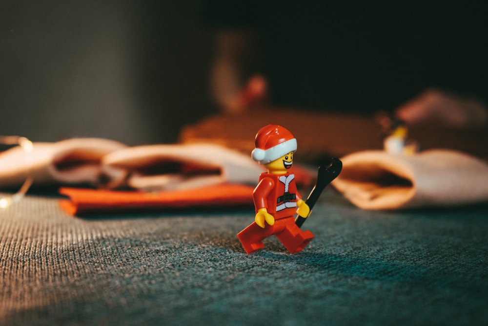 shallow focus photo of man wearing Christmas hat mini figure