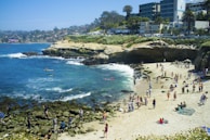 A vibrant beach scene with people enjoying the sun.