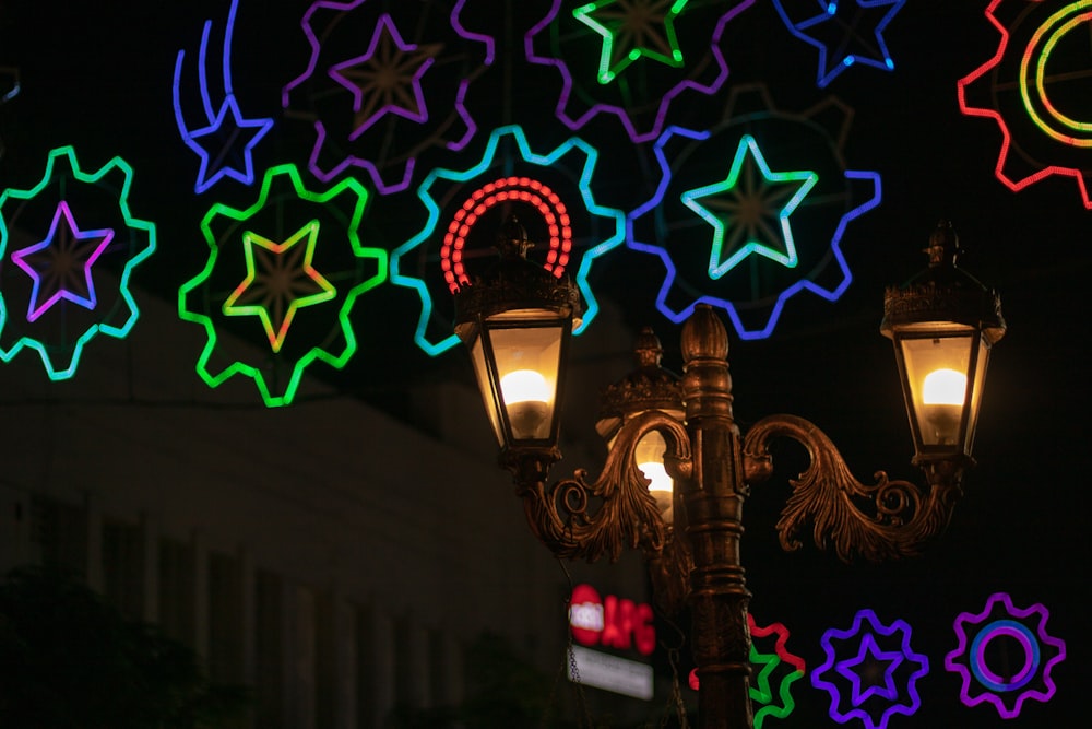 turned-on brass-colored light post