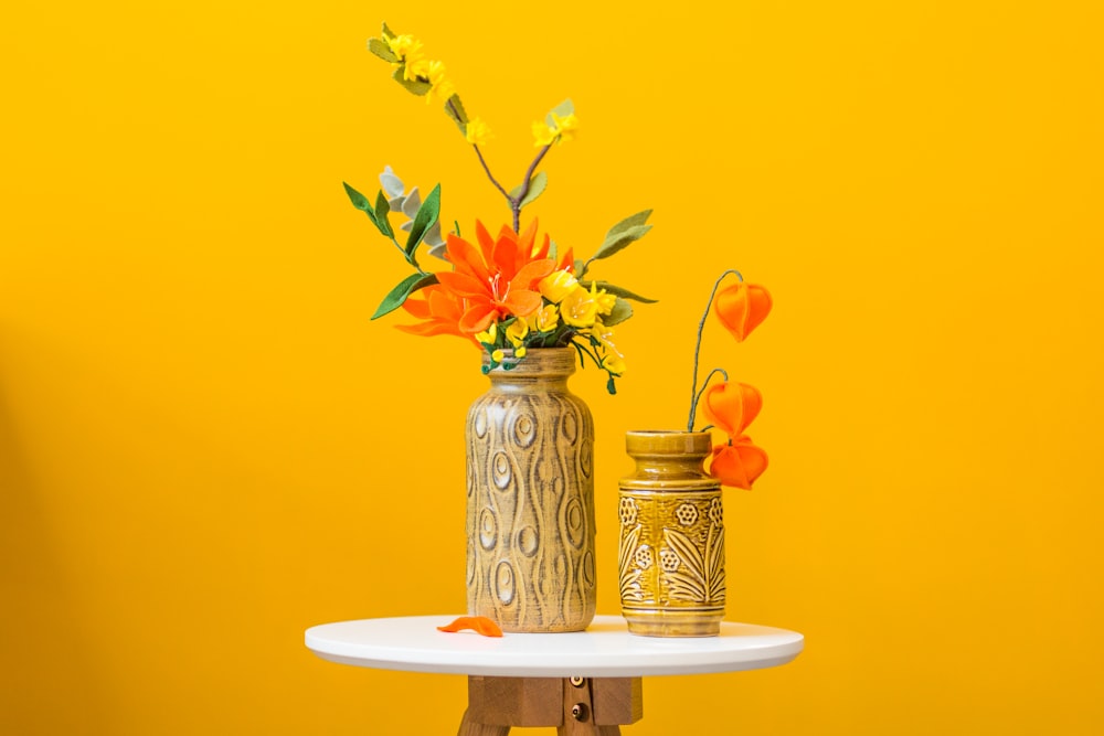 red flowers on brown vase