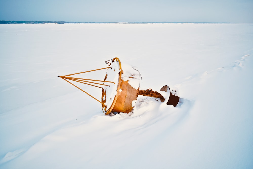 yellow floating bouy on white icy surface