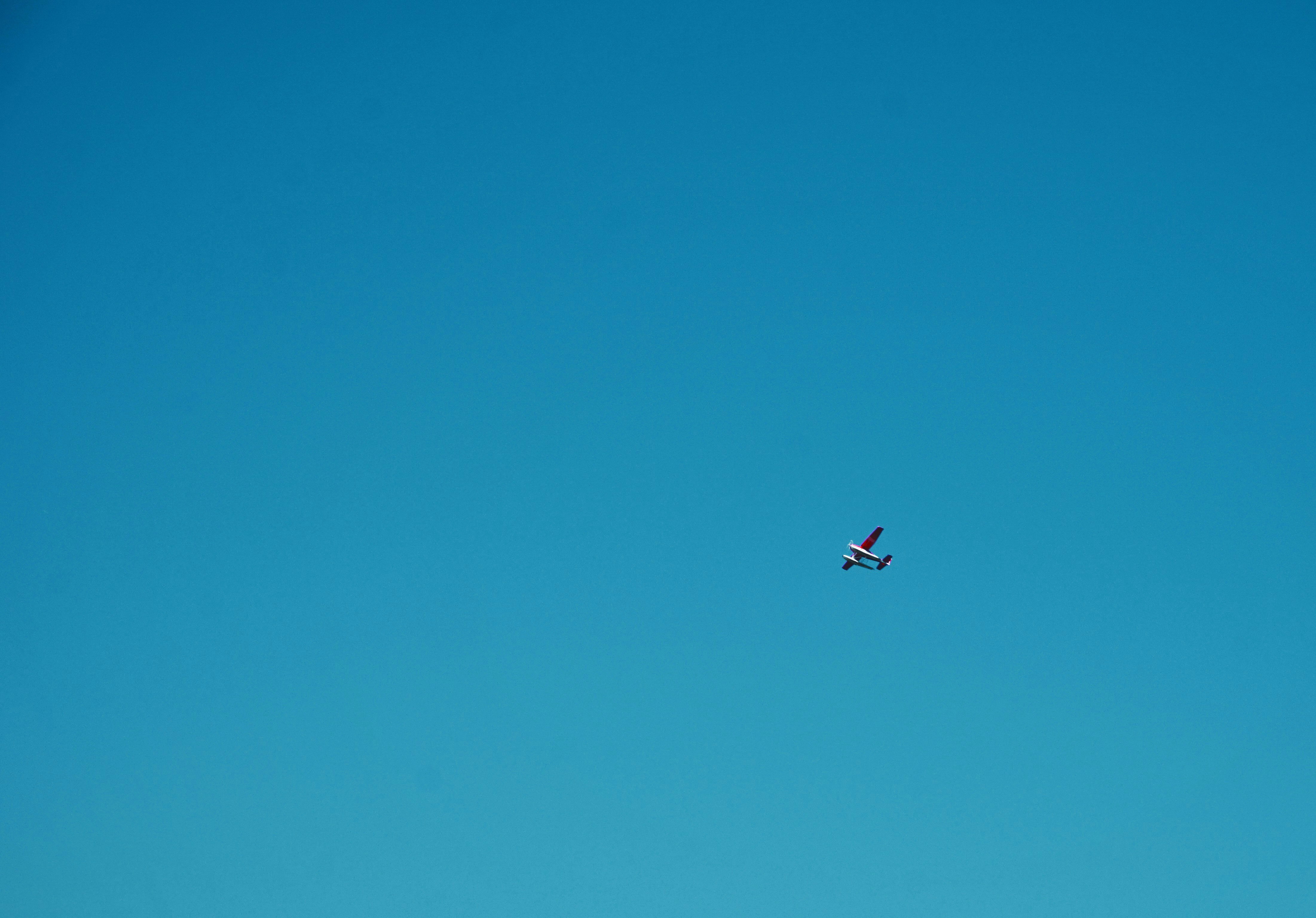 white plane under blue sky during daytime
