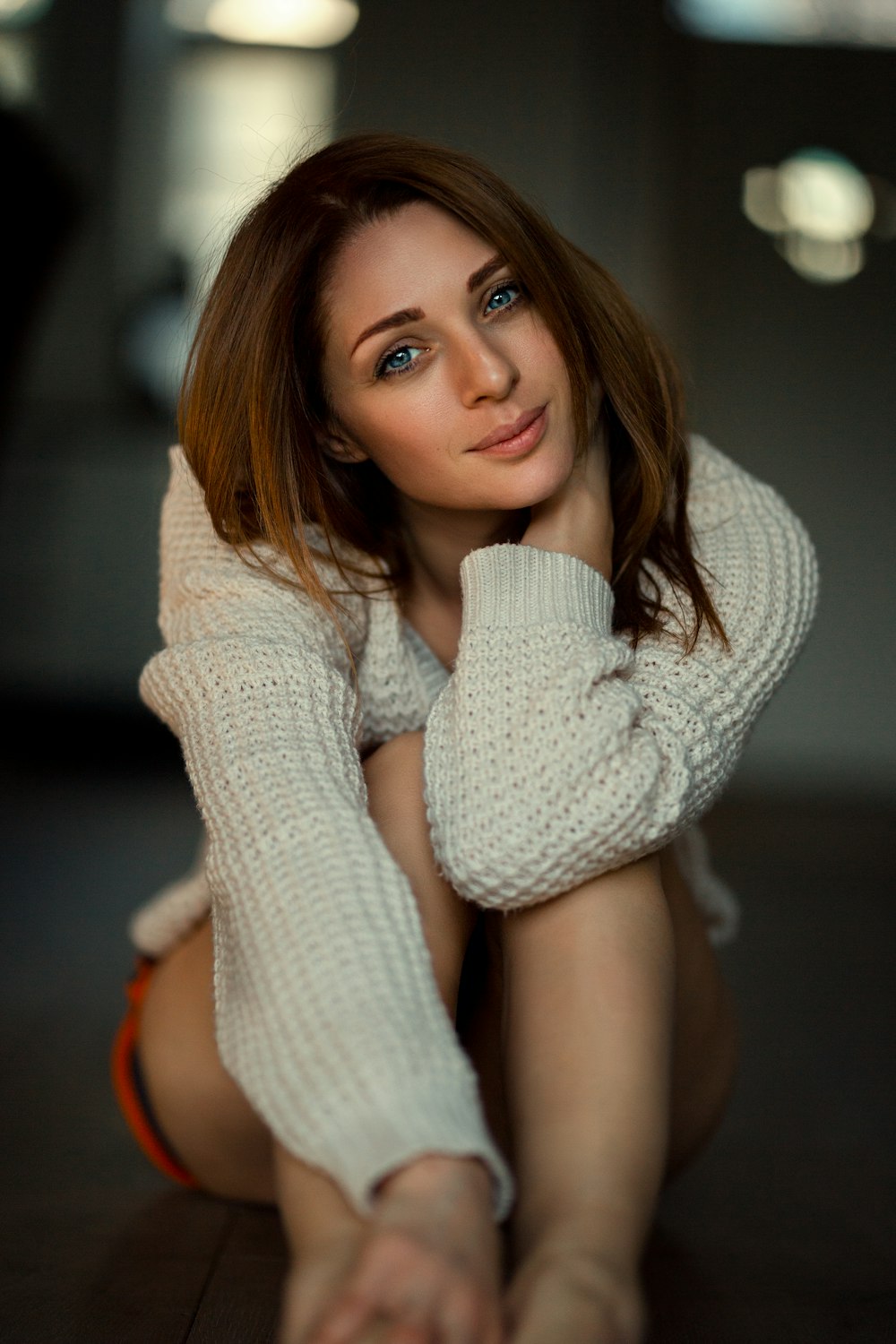 woman wearing white sweater