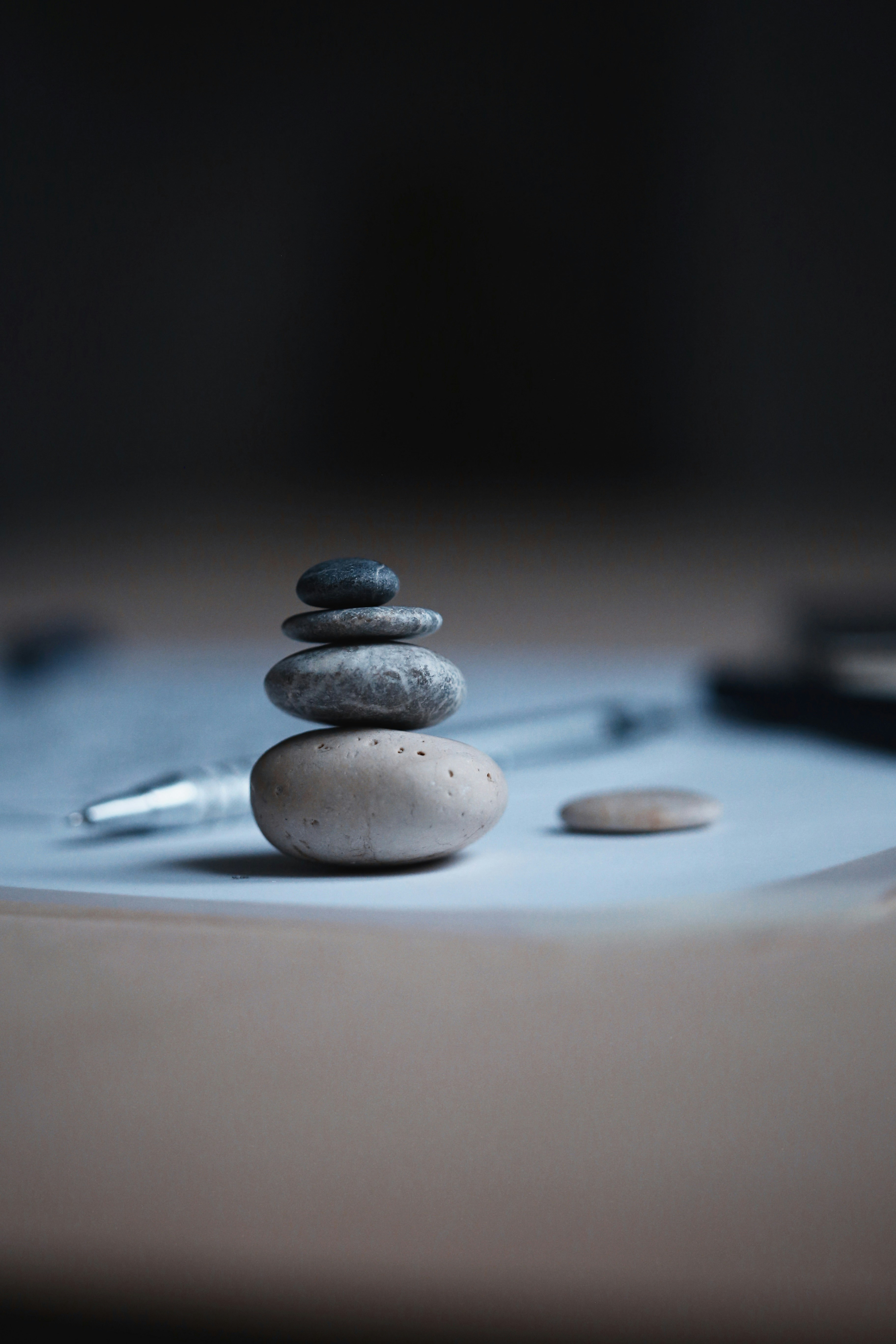 I like to keep a set of pebble, so i can play with them and build stone towers, while having a coffeebreak or so…