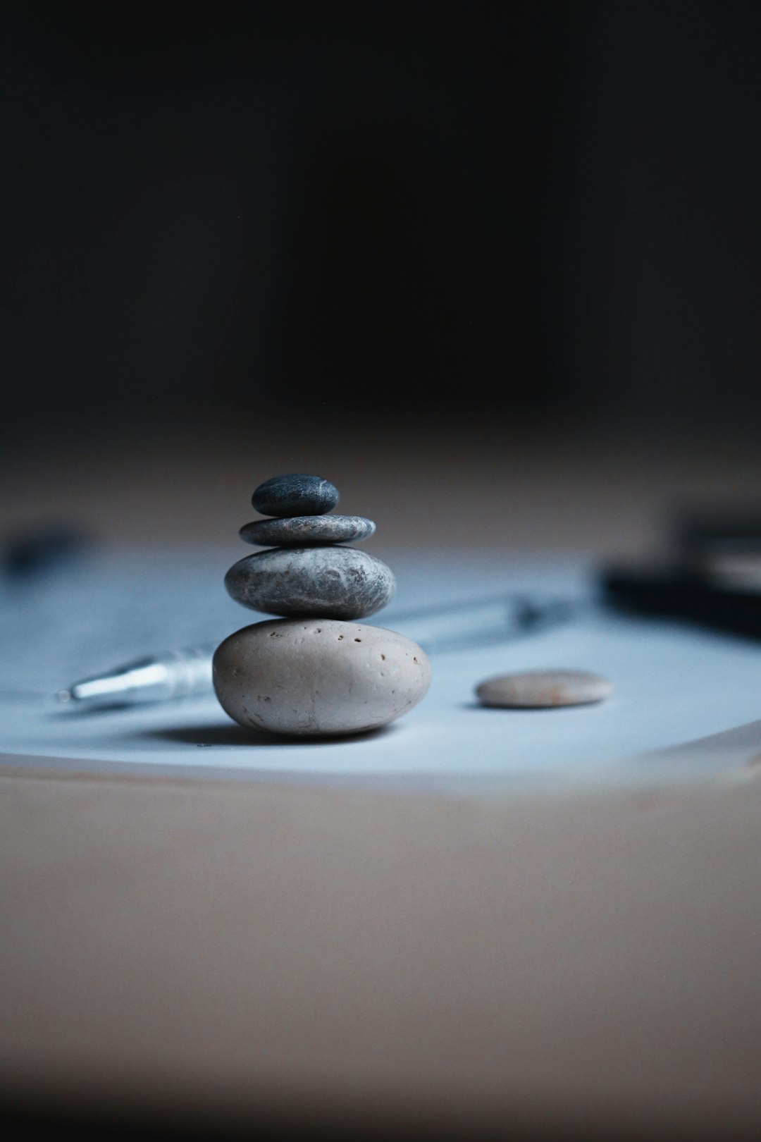  shallow focus photo of balance stones weighing balance