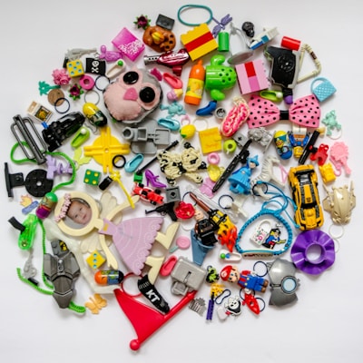 Colorful assortment of toys and electronic gadgets on a white background.