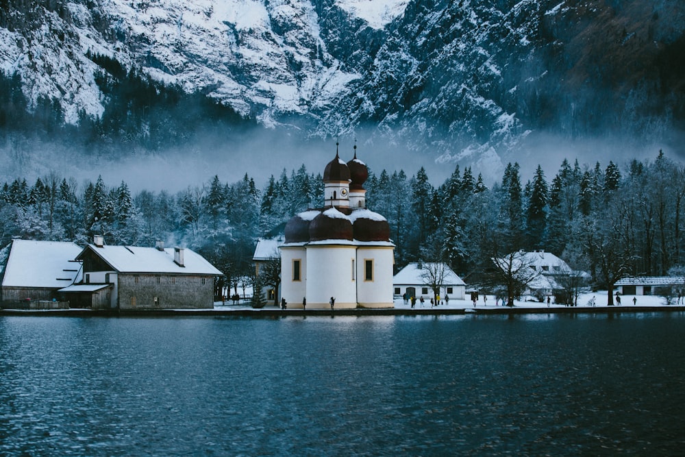 white concrete building near sea