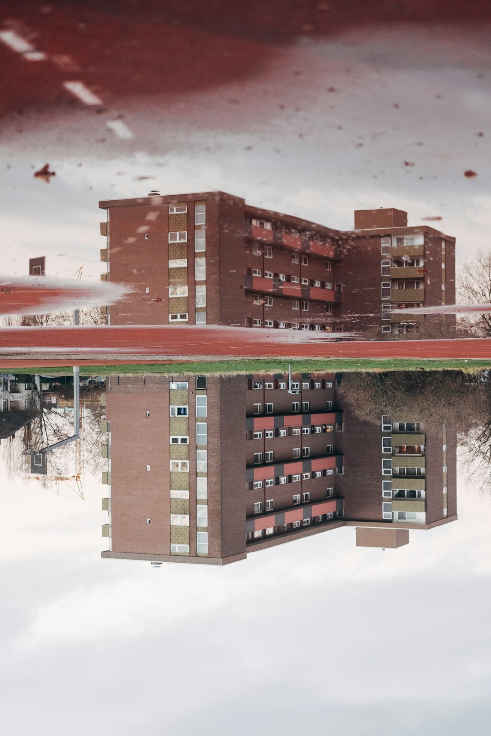 brown concrete building near body of water during daytime