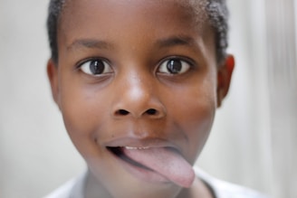 boy sticking his tongue out