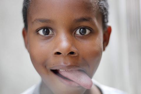 boy sticking his tongue out