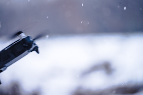 A dynamic videographer capturing footage with a drone.