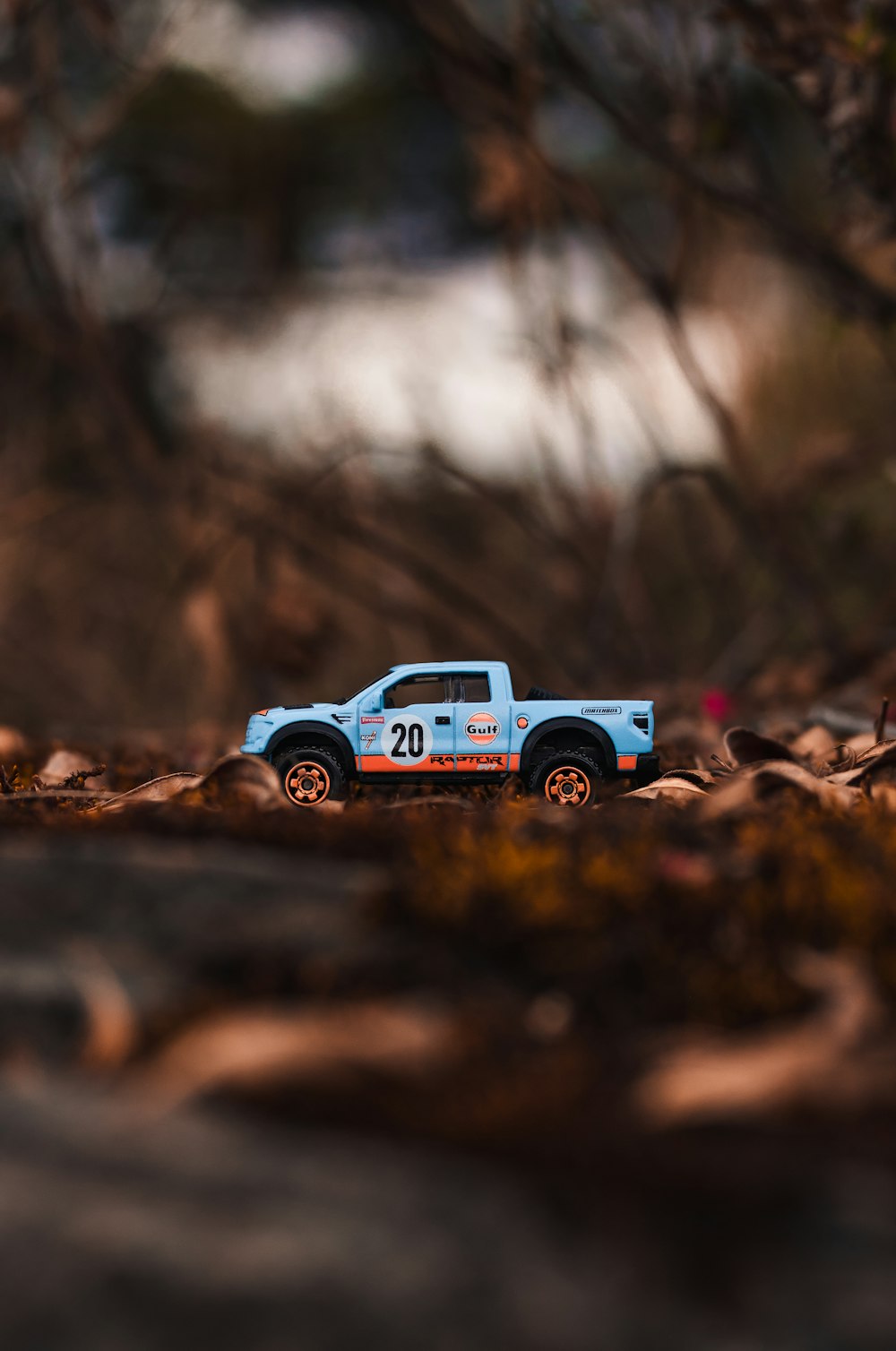 blue truck scale model on ground